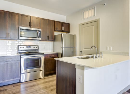 a view of a kitchen with silver appliances