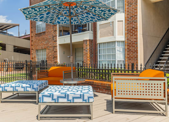 outdoor lounge area with umbrella