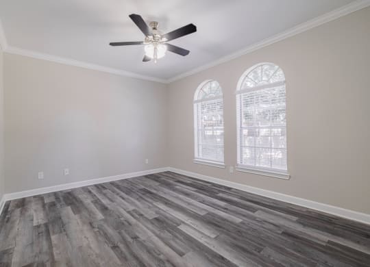 living room with hardwood-style flooring and ceiling fan