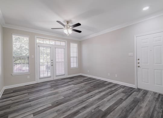 living room with hardwood-style flooring and ceiling fan