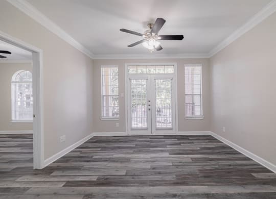 living room with hardwood-style flooring and ceiling fan