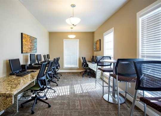 A row of chairs are lined up in a room.