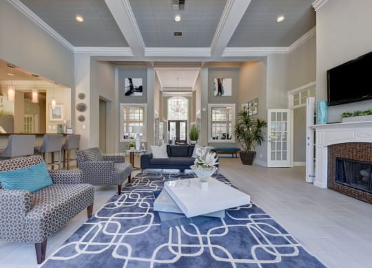 a living room with gray walls and a white coffered ceiling