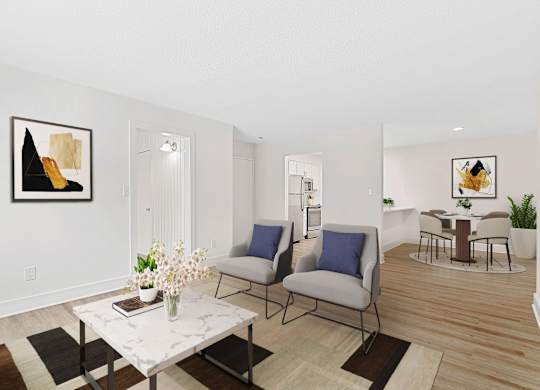 A living room with a white marble table and two grey chairs. at Woodlyn on the Green Apartment Homes, Cary, North Carolina