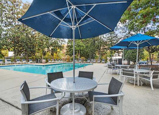 Poolside Relaxing Chairs at Woodlyn on the Green Apartment Homes, Cary, NC, 27513