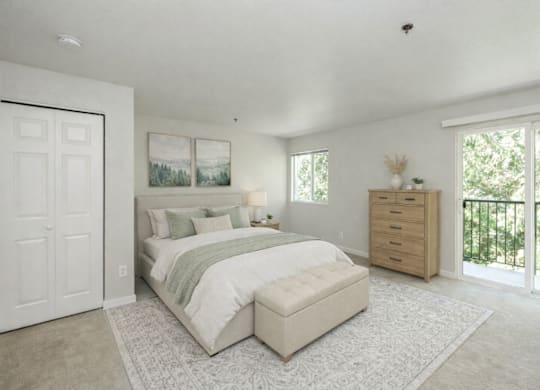 A bedroom with a large bed and a dresser.