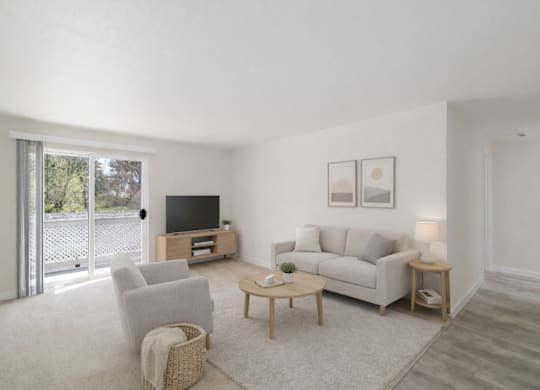 A living room with a white couch, a wooden coffee table, and a television.