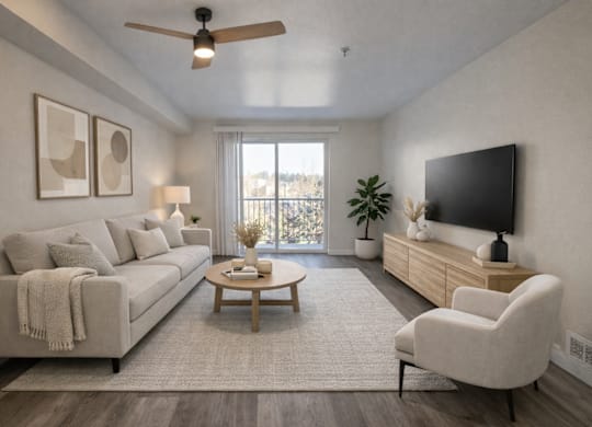 A living room with a couch, a chair, a coffee table, and a flat-screen TV.