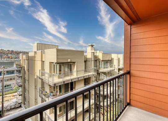 a balcony with a view of buildings in a city at Illumina Apartment Homes, Washington, 98102