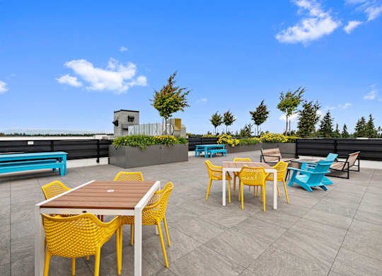 Resident rooftop terraces with tables and chairs at Arabella Apartment Homes, Shoreline, Washington 98155