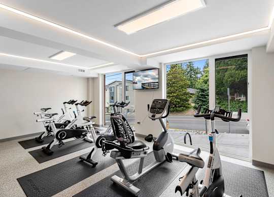 Resident Fitness Facilities filled with exercise equipment at Arabella Apartment Homes, Shoreline, 98155