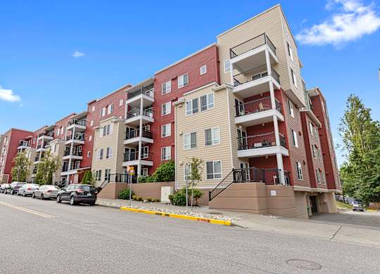 a large view of the property building with balconies at Arabella Apartment Homes, Washington, 98155