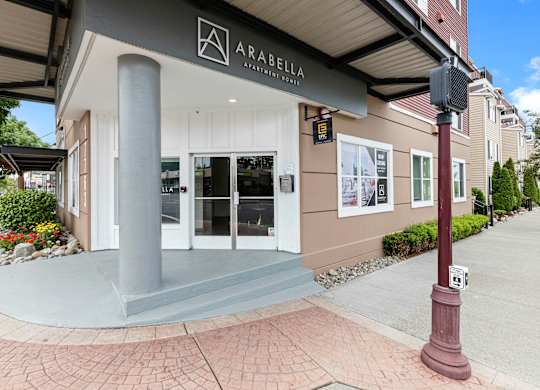 View of the property entrance with Property Signage at Arabella Apartment Homes, Shoreline, WA