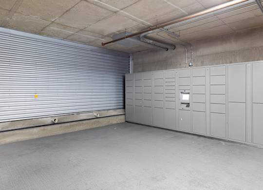 a row of package lockers in a storage facility at Villaggio Apartment Homes, Tacoma, 98402