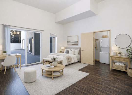 A modern bedroom with a white bed and a wooden floor.