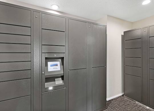 a row of package receiving lockers in the resident package room at Pinewood Square Apartment Homes, Lynnwood