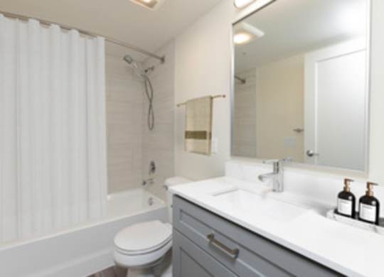 a bathroom with a sink toilet and a shower at Illumina Apartment Homes, Seattle, WA, 98102