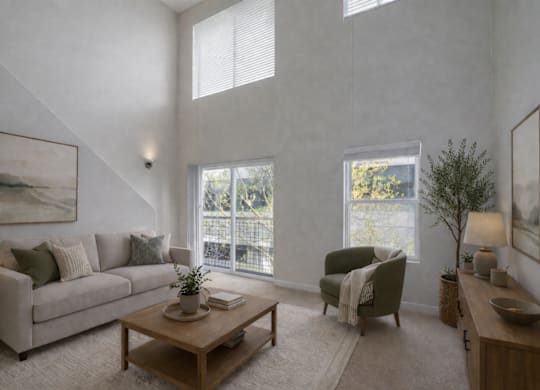 A living room with a couch, chair, and a coffee table.