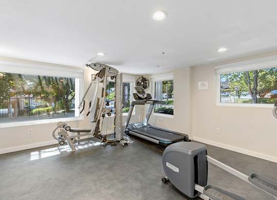 Fitness Facilities with a Treadmill, Weights, and Oversized Windows for an Abundance of Light  at Sir Gallahad Apartment Homes, Bellevue, WA