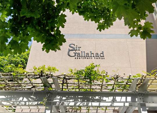 a sign on the side of a building at Sir Gallahad Apartment Homes, WA 98004