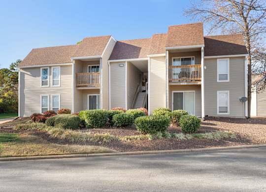 A two-story apartment building with a balcony on the second floor at Lakes Edge Apartments, North Carolina