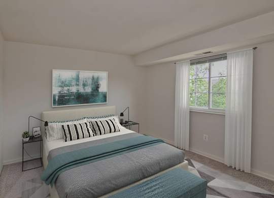 A bedroom with a large bed and a painting on the wall.