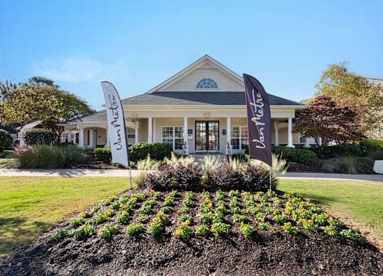 A building with a sign at Village on the Lake Apartments, Spring Lake, NC, 28390