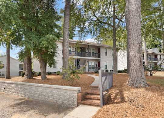 A tree in front of a building. at Hunter's Ridge Apartments, Fayetteville, NC, 28305