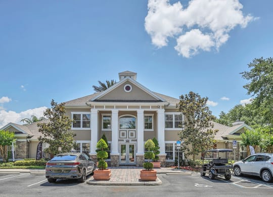 a large building with cars parked in front of it at Northlake Park, Orlando
