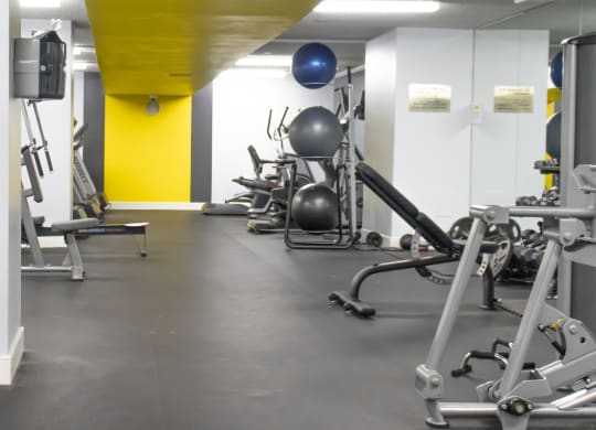 a gym with weights and other exercise equipment at The Aspen, Virginia, 22305