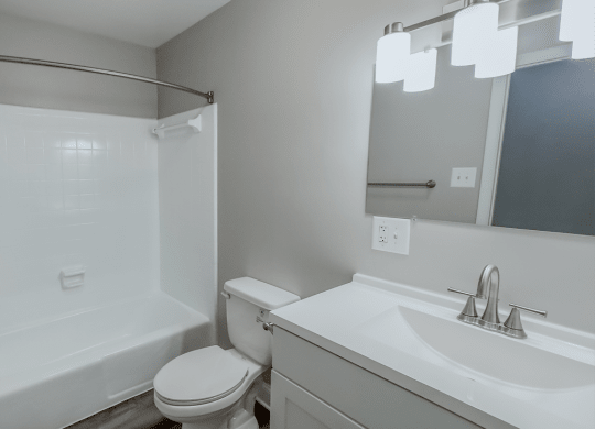 an empty bathroom with a sink toilet and shower at Middletown Valley, 21769