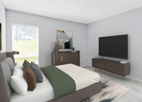 Bedroom with a bed and a television at Lakes Edge Apartments, Greensboro, North Carolina