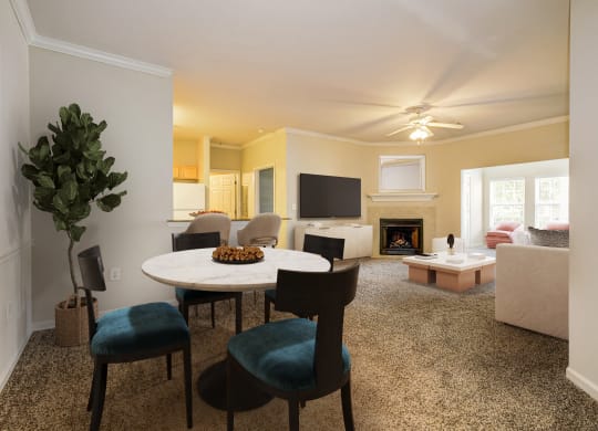 Living Room with a round table at Village on the Lake Apartments, Spring Lake, North Carolina
