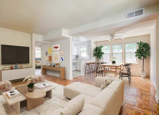 A living room with a white couch and a wooden coffee table. at Park Georgetown Apartments, Virginia