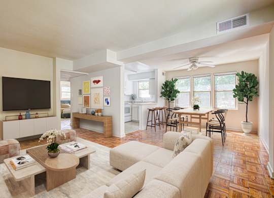 A living room with a white couch and a wooden coffee table. at Park Georgetown Apartments, Arlington, VA, 22209