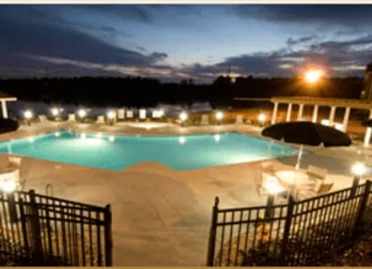 Night view of the Swimming Pool and Sundeck at Village on the Lake Apartments, Spring Lake, 28390