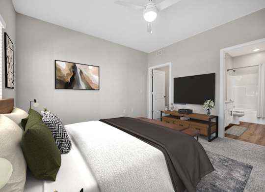 A bedroom with a large bed and a flat screen TV.
