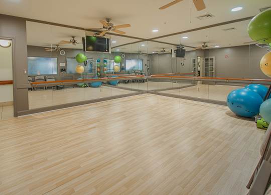 Yoga room with wooden floor at The Marque, Gainesville, Virginia