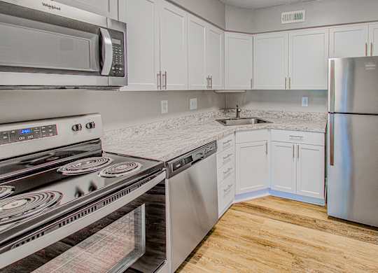 White cabinetry in kitchen at Tuscarora Creek, Leesburg, Virginia