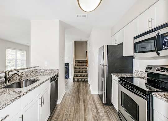 White cabinetry in kitchen at Saratoga Square, Springfield, Virginia