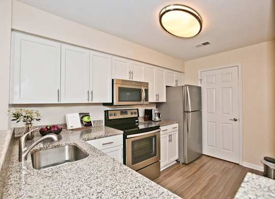 White cabinets in kitchen at Saratoga Square, Virginia, 22153