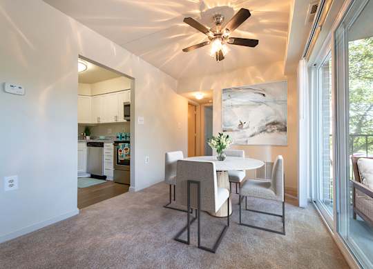 Dining room with ceiling fan at Tuscarora Creek, Leesburg, 20175