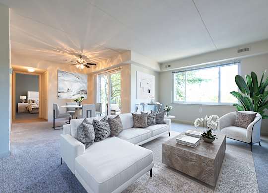 Living room with white couch at Tuscarora Creek, Leesburg, VA