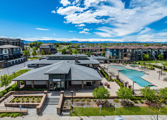 an aerial view of a community with a pool and buildings at Arbour Commons, Colorado, 80023