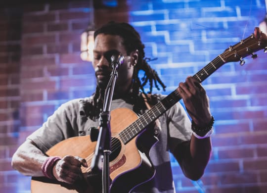 Man Playing Guitar at The Collective NoDa, North Carolina