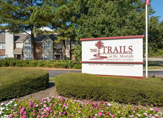 the trails at the north apartments sign at the trails in the month of april