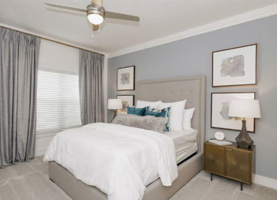 Bedroom With Ceiling Fan at Cue Luxury Apartments, Cypress