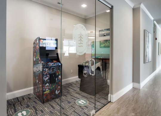 a room with two vending machines and a glass door