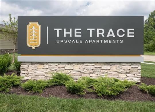 a large sign for the race upscale apartments