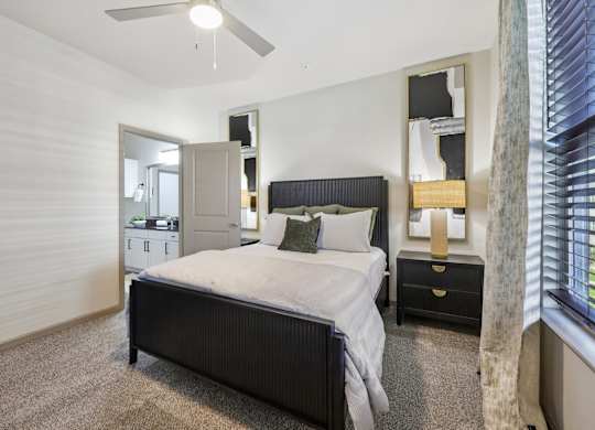 bedroom with ceiling fan at Vine + Vail Townhomes and Apartments, Grapevine, TX 76051
